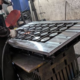 Workers at Drax Molds are manufacturing block-making machine molds in the workshop.